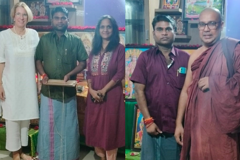 A Nadi reader explaining a palm leaf reading to a client